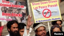 Hafiz Saeed, head of the Jamaat-ud-Dawa organisation and founder of Lashkar-e-Taiba, (2nd R) addresses supporters during a protest against U.S. drone attacks in the Pakistani tribal region, in Lahore, Nov. 29, 2013. 