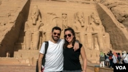 FILE - Egyptian Fady Abadir and his American wife Melis Bursin, who marveled at the experience. “It’s the first time for me here in Egypt," Mursin said. "It’s like a dream for me.” In Abu Simbel temple in Aswan, southern Egypt, Feb. 22, 2018. (H. Elrasam/VOA)