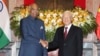 Indian President Ram Nath Kovind, left, shakes hands with Vietnamese President Nguyen Phu Trong before heading for talks behind closed doors in Hanoi, Vietnam, Tuesday, Nov. 20, 2018.