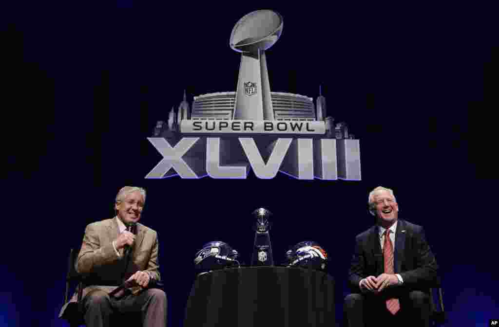 Seattle Seahawks head coach Pete Carroll and Denver Broncos head coach John Fox speak at a news conference, Jan. 31, 2014, in New York. 
