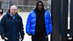 R. Kelly, right, leaves Cook County Jail with his defense attorney, Steve Greenberg, Feb. 25, 2019, in Chicago.