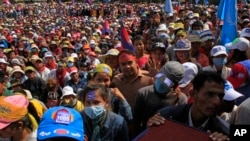 Cambodian's opposition party supporters gather during their party continuing of its mass demonstration at Democracy Square, in Phnom Penh, file photo. 