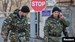 Ukrainian soldiers outside the Ukrainian infantry base in Perevalne, Ukraine, March 12, 2014. 
