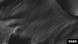 This image from the High Resolution Imaging Science Experiment (HiRISE) camera on NASA's Mars Reconnaissance Orbiter is an example of a type called "linear gullies." (NASA/JPL-Caltech/Univ. of Arizona) 