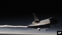 Space Shuttle Atlantis lands at the Kennedy Space Center at Cape Canaveral, Florida, July 21, 2011