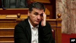 Greek Finance Minister Euclid Tsakalotos attends a parliamentary session in Athens, Dec. 5, 2015.