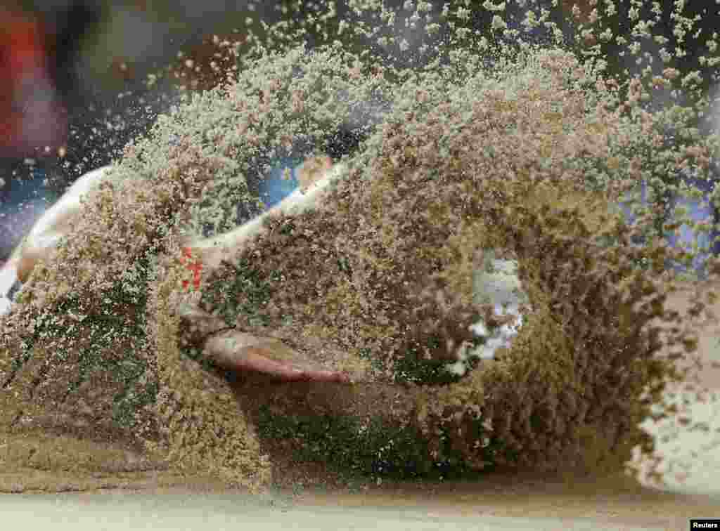 Wang Jianan of China competes in the men&#39;s long jump final during the 15th IAAF World Championships at the National Stadium in Beijing, China.