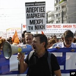 Protesters shout slogans during demonstration in Athens, Greece, October 5, 2011.