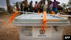 FILE - A closed ballot box waits to be taken to an electoral commission after voting in Buwuno, Uganda, on Feb. 18, 2011. 