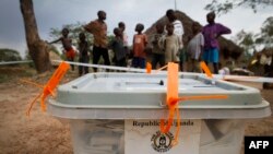 FILE - A closed ballot box waits to be taken to an electoral commission after voting in Buwuno, Uganda, on Feb. 18, 2011. 