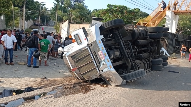 An overturned truck is seen after a trailer crash in the southern Mexican state of Chiapas killed at least 50 people, most of them migrants from Central America, in Tuxtla Gutierrez, Chiapas, Mexico December 9, 2021.