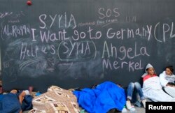 Migrants sleep near the Keleti railway station in Budapest, Hungary, Sept. 3, 2015.