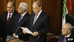 FILE - Lebanese President Michel Aoun (C) delivers a speech in parliament, in downtown Beirut, Lebanon, Oct. 31, 2016.