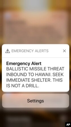 FILE - This Jan. 13, 2018, file smartphone screen capture shows a false incoming ballistic missile emergency alert sent from the Hawaii Emergency Management Agency system.