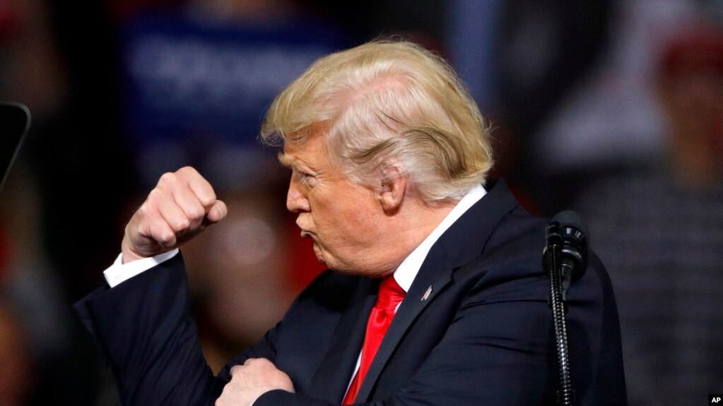 President Donald Trump addresses the crowd during a campaign rally Saturday, Oct. 6, 2018, in Topeka, Kan.