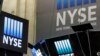 The top of a trading post and an NYSE banner above the trading floor of the New York Stock Exchange are shown, Nov. 10, 2016.