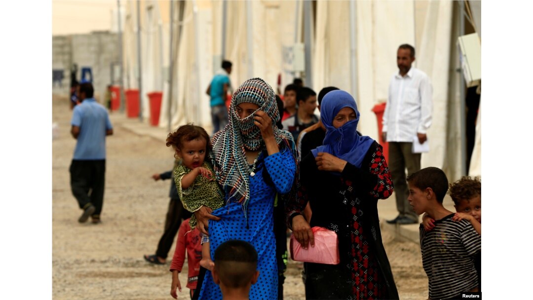 Displaced people, who fled from homes are seen at Hamam al-Alil camp south of Mosul, Iraq July 13, 2017.
