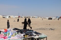 The al-Hol Camp in northeastern Syria holds about 60,000 women and children, the families of IS fighters now missing, detained or dead, in al-Hol, Syria, Oct. 20, 2021. (Heather Murdock/VOA)