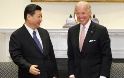 Biden ve Xi, 14 Şubat 2012 tarihine ait bu fotoğrafta Beyaz Saray'ın Roosevelt Salonu'nda görüntülenmiş.