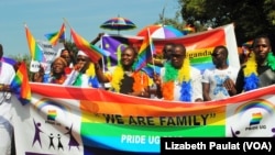 People who identified themselves as members of the lesbian, gay, bisexual and transgender (LGBT) community parade in Entebbe, southwest of Uganda's capital, Kampala, Aug. 8, 2015. 