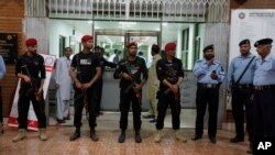 Pakistani police commandos stand guard outside the cardiac ward, where jailed former prime minister Nawaz Sharif was moved, in Islamabad, Pakistan, July 29, 2018.