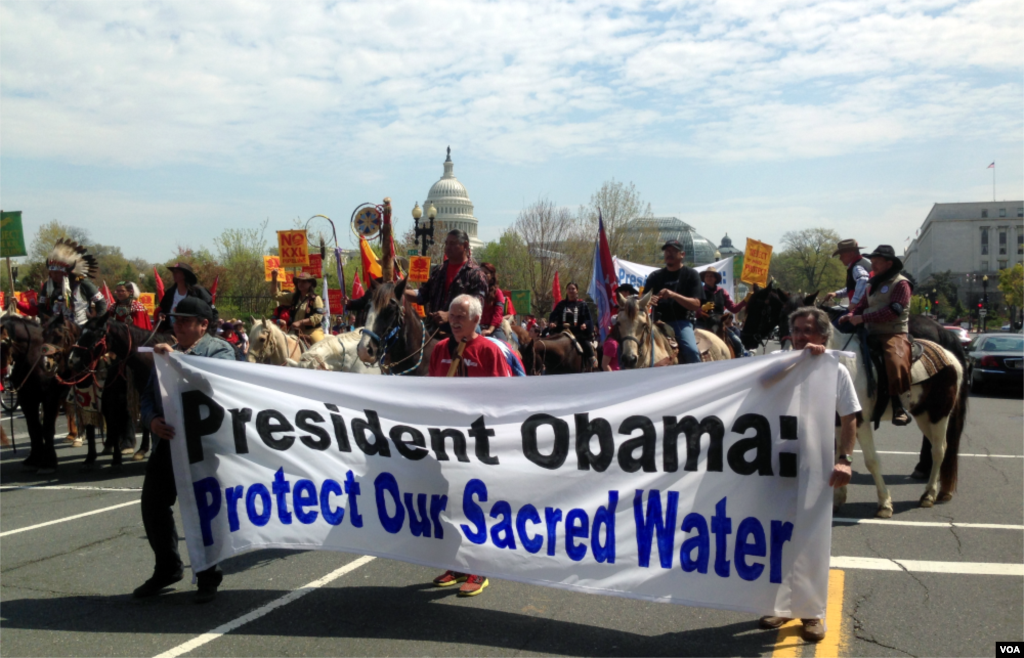 Native Americans, farmers, ranchers, and cowboys gather outside the Capitol Hill during a &quot;Reject and Protect&quot; rally to protest against the Keystone XL tar sands pipeline, Washington D.C., April 22, 2014. (Diaa Bekheet/VOA)