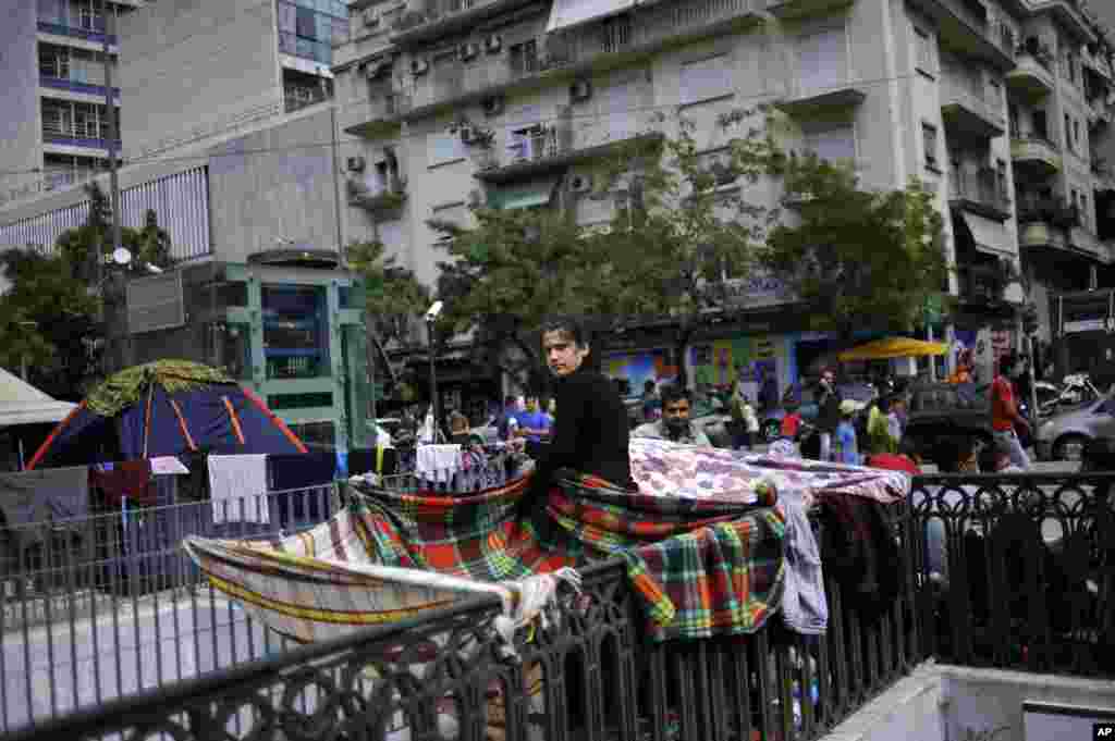 Many migrants stay temporarily at Victoria Square in Athens, Greece, before continuing their trip to more prosperous northern European countries.