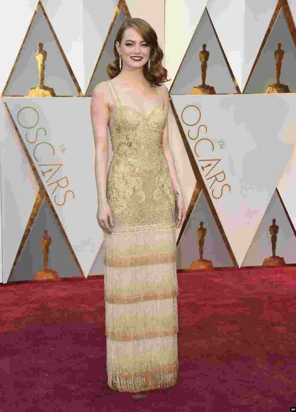 Emma Stone arrives at the Oscars on Sunday, Feb. 26, 2017, at the Dolby Theatre in Los Angeles.