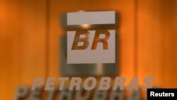 FILE - The logo of Brazil's state-run oil company Petrobras is pictured in the company headquarters in Sao Paulo, Brazil.