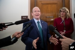 Sen. Chris Coons, D-Del., a member of the Senate Foreign Relations Committee, speaks with reporters as senators are considering multiple pieces of legislation in an effort to formally rebuke Saudi Arabia for the slaying of journalist Jamal Khashoggi, on Capitol Hill in Washington, Dec. 6, 2018.