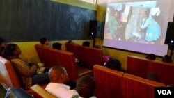  A group watches their movie at the Bioscope Independent Cinema after making a film at the Home Movie Factory in Johannesburg, South Africa. (Peter Cox/VOA)