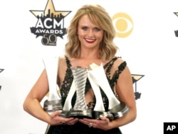 Miranda Lambert poses in the press room with the multiple awards at the 50th annual Academy of Country Music Awards at AT&T Stadium, April 19, 2015.