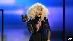 Nicki Minaj accepts the award for favorite artist - rap/hip-hop at the 40th Anniversary American Music Awards on Nov. 18, 2012, in Los Angeles. 