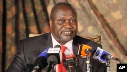 FILE - South Sudan rebel leader Riek Machar addresses journalists during a news conference in Nairobi, Kenya.