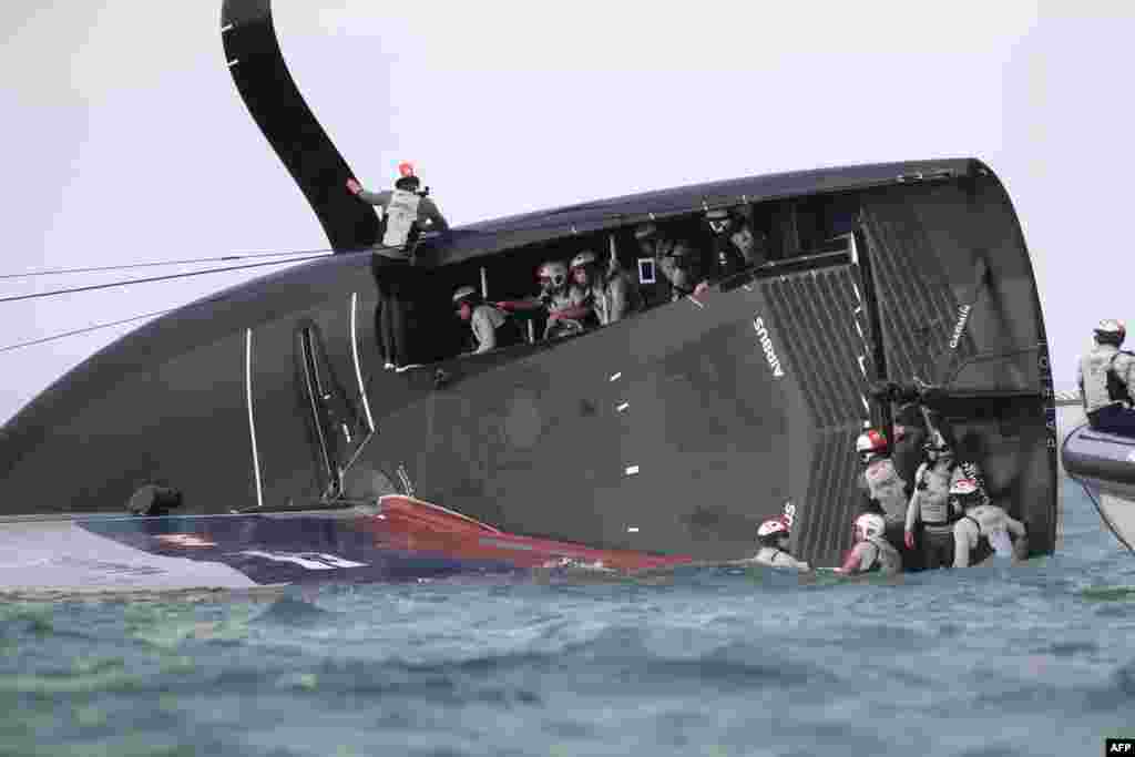 New York Yacht Club American Magic is capsized during Round Robin two, Race three against Luna Rossa Prada Pirelli of the Prada Cup 2021, the challengers series of the 36th America&#39;s Cup in Auckland, New Zealand.