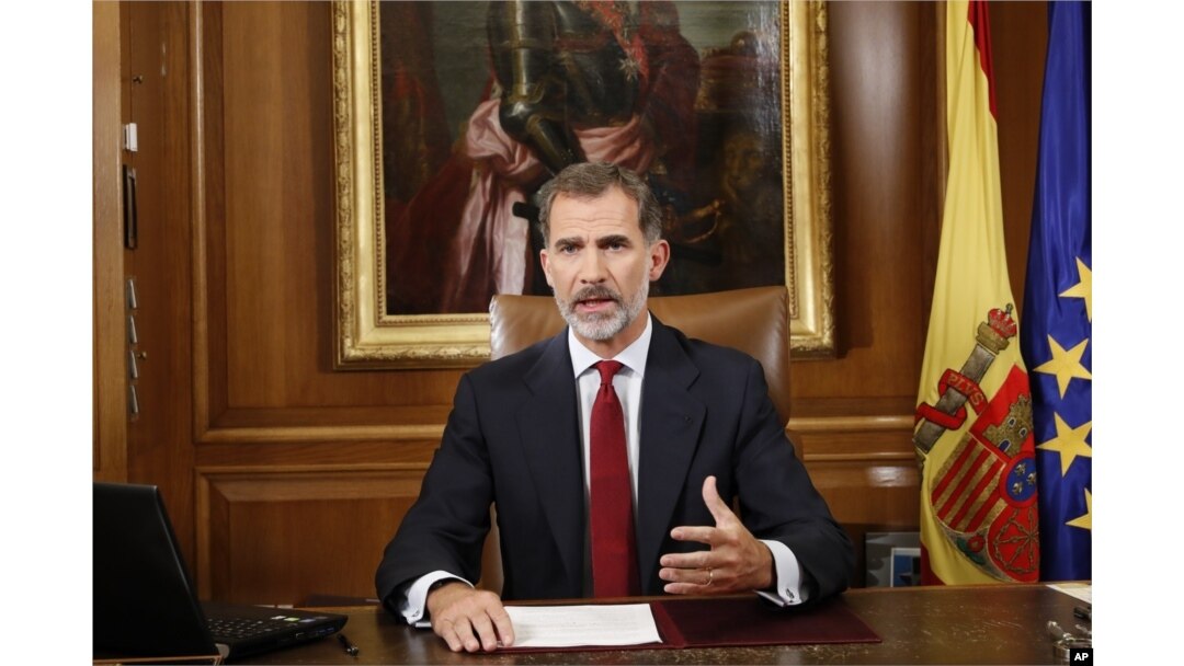 In this image released by the Spanish Royal Palace, Spain's King Felipe VI delivers a speech on television from Zarzuela Palace in Madrid, Oct. 3, 2017.