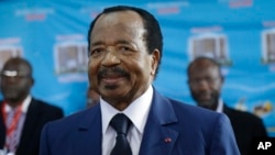 Cameroon's Incumbent President Paul Biya, of the Cameroon People's Democratic Movement party, waits to cast his vote during the presidential elections in Yaounde, Oct. 7, 2018.
