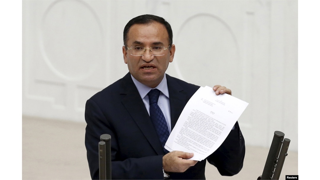 FILE - Justice Minister Bekir Bozdag addresses the Turkish Parliament during a debate in Ankara, March 19, 2014.