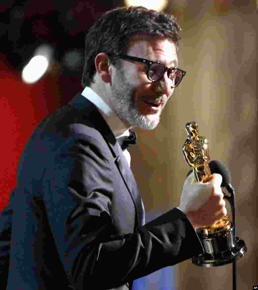 Director Michel Hazanavicius accepts the best director award for 'The Artist' at the Academy Awards, Feb. 26, 2012. (AP)