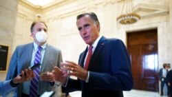 Sen. Mitt Romney, R-Utah, talks briefly to reporters after attending a bipartisan barbecue luncheon, at the Capitol in Washington, Sept. 23, 2021.