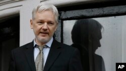 FILE - WikiLeaks founder Julian Assange speaks from the balcony of the Ecuadorean Embassy in London, Feb. 5, 2016.