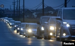 A traffic jam is seen as people evacuate after tsunami advisories were issued following an earthquake, in Iwaki, Fukushima prefecture, Japan, in this photo taken by Kyodo, Nov. 22, 2016.