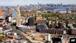 FILE - the construction site of Atlantic Yards in downtown Brooklyn, foreground, is shown with the New York skylne in the distance.