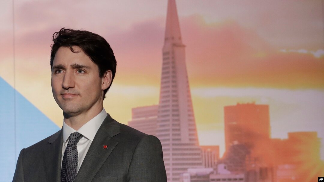 Canada's Prime Minister Justin Trudeau waits to speak at the AppDirect office in San Francisco, Feb. 8, 2018.