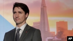 Canada's Prime Minister Justin Trudeau waits to speak at the AppDirect office in San Francisco, Feb. 8, 2018. 