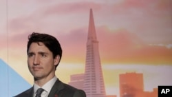 FILE - Canada's Prime Minister Justin Trudeau waits to speak at the AppDirect office in San Francisco, Feb. 8, 2018. 