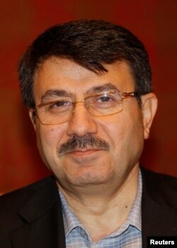 FILE - Member of the Syrian opposition Hisham Marwah attends a meeting announcing the results of the 11-member executive committee in Doha, Nov. 9, 2012.