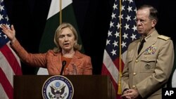 U.S. Secretary of State Hillary Rodham Clinton addresses a news conference with Adm. Mike Mullen, the chairman of the U.S. Joint Chiefs of Staff at U. S. embassy in Islamabad, Pakistan, May 27, 2011.