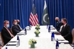 FILE - U.S. Secretary of State Antony Blinken, right, meets with Pakistani Foreign Minister Shah Mahmood Qureshi on the sidelines of the 76th U.N. General Assembly in New York City, Sept. 23, 2021.