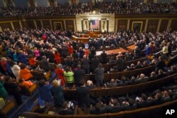 President Barack Obama is applauded as he gives his State of the Union address before a joint session of Congress on Capitol Hill in Washington, Jan. 12, 2016.